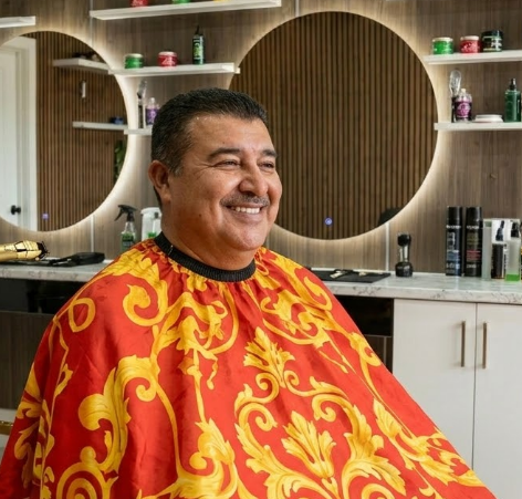 Happy customer after men's haircut at Good Hand Barber Collinswood